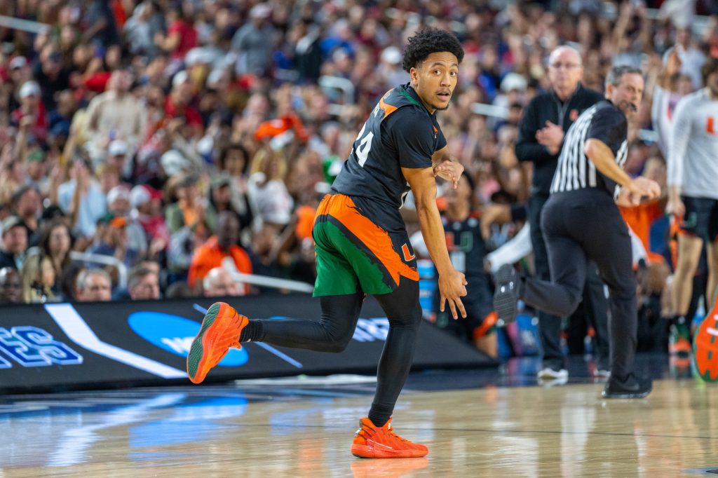 Third-year sophomore guard Nijel Pack celebrates a three pointer during the first half of Miami’s Final Four matchup against the University of Connecticut in NRG Stadium in Houston on April 1, 2023.