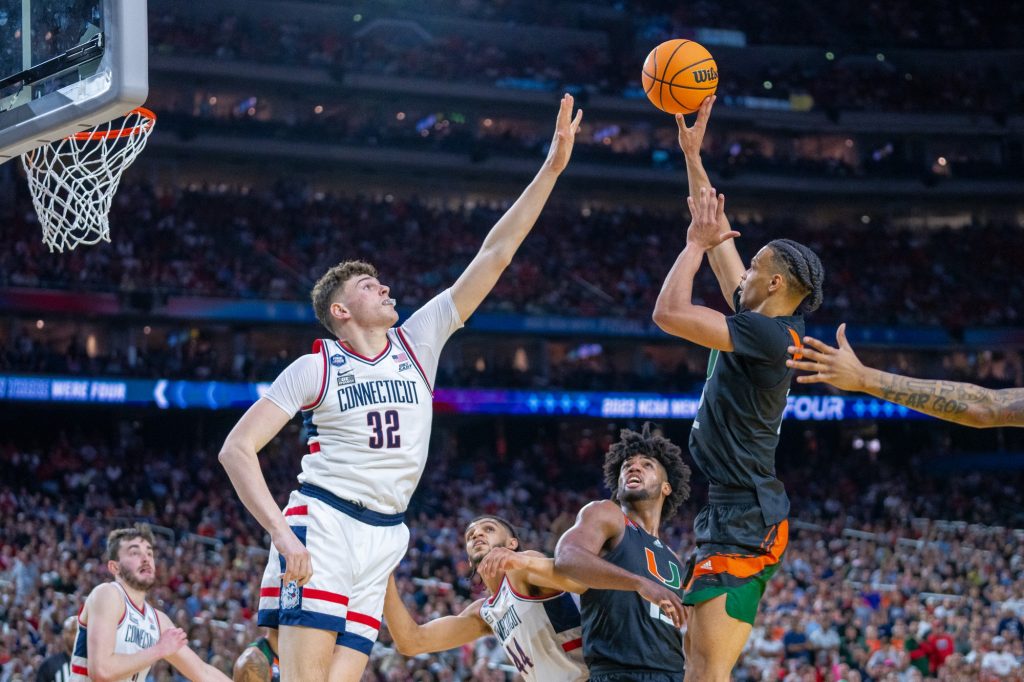 Fourth-year junior guard Isaiah Wong shoots during the second half of Miami’s Final Four matchup against the University of Connecticut in NRG Stadium in Houston on April 1, 2023.