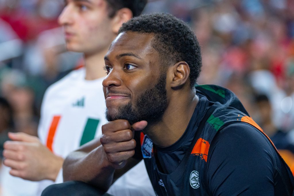 Sophomore guard Wooga Poplar grimaces on the Miami bench during the second half of Miami’s Final Four matchup against the University of Connecticut in NRG Stadium in Houston on April 1, 2023.