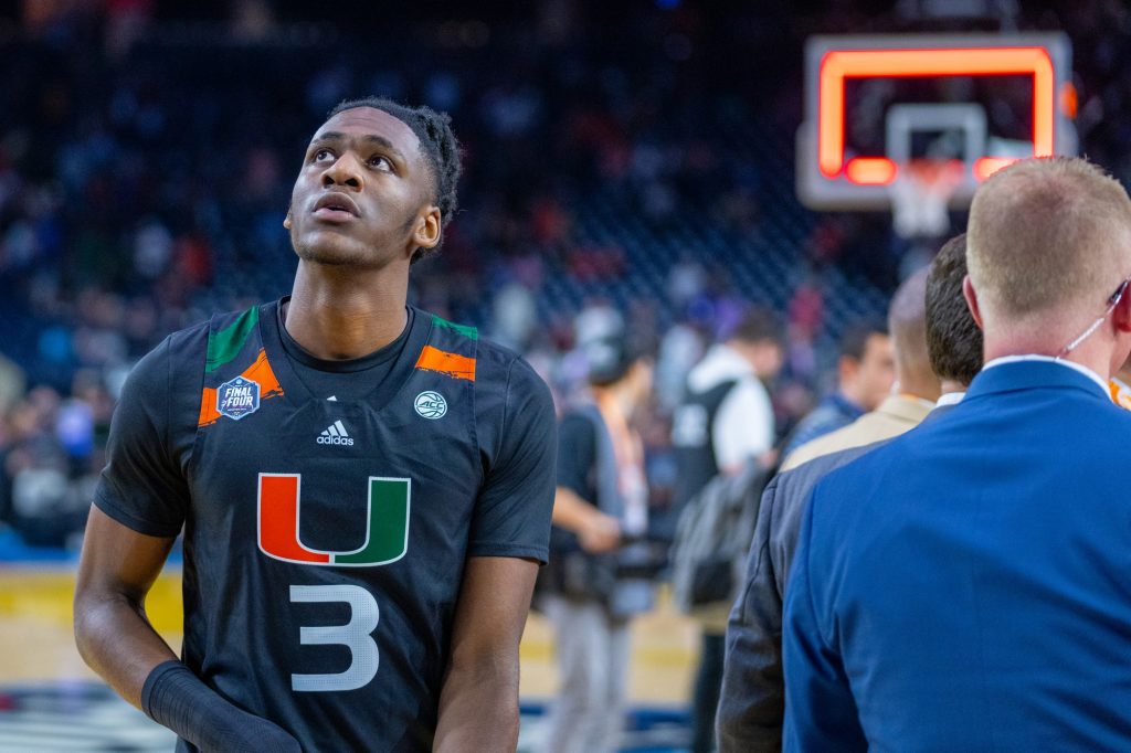 Freshman guard Christian Watson looks at the scoreboard as he exits the court after Miami’s 59-72 Final Four loss to the University of Connecticut in NRG Stadium in Houston on April 1, 2023.