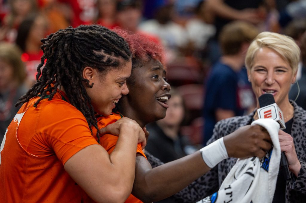 Destiny Harden and Ja’Leah Williams express their excitement to an ESPN reporter after defeating the Villanova Wildcats in Miami’s Sweet Sixteen matchup in the Bon Secours Wellness Arena on Friday, Mar. 24.