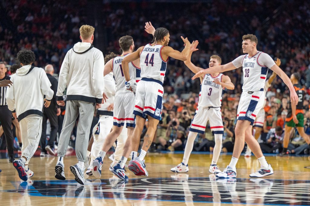 University of Connecticut celebrate a deep three-point shot to end the first half during Miami's Final Four loss on Saturday, April 1 at the NRG Stadium.
