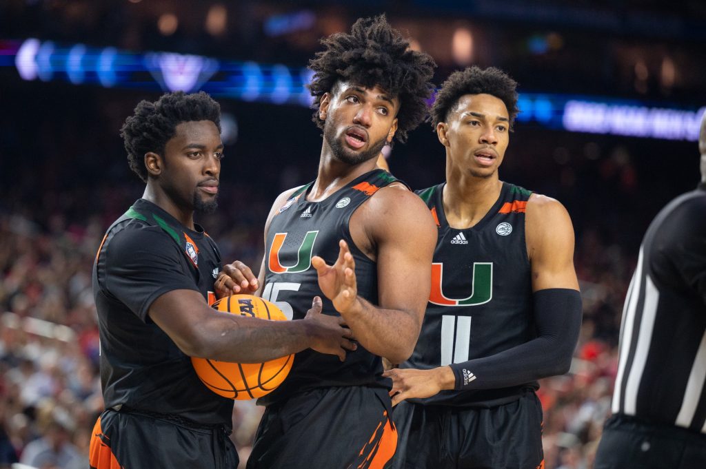 Miami players look at the referee following a tense moment with University of Connecticut players during the second half of Miami's Final Four loss on Saturday, April 1 at the NRG Stadium.