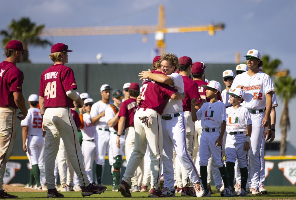 Miami and Florida State players embrace after the Hurricanes' 13-4 win on April 2 at Mark Light Field.