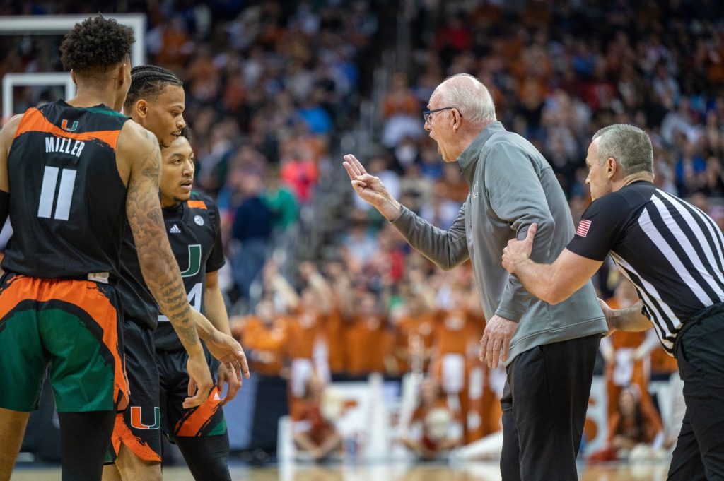 Head coach Jim Larrañaga makes a call to players on the court during the final minutes of Miami's Elite Eight win over the University of Texas on Sunday, March 26 at the T-Mobile Center.