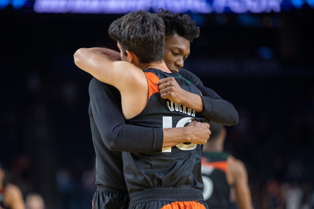 Teammates Anthony Walker and Filippos Gkogkos hug following Miami's Final Four loss to the University of Connecticut on Saturday, April 1 at the NRG Stadium.