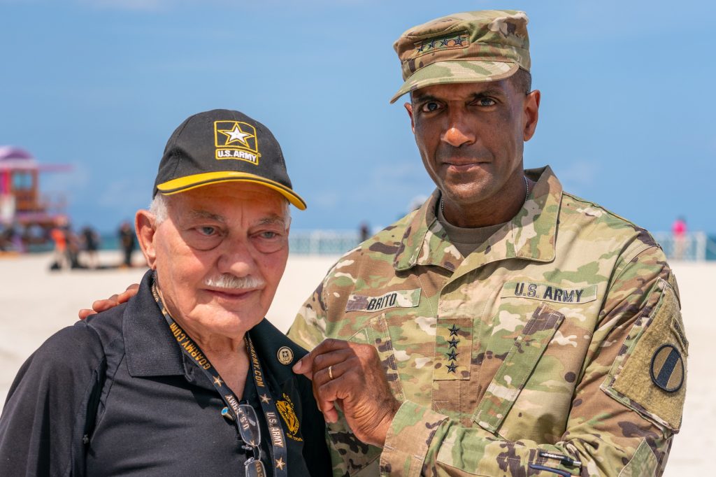 General Gary M. Brito poses with a veteran after giving him a “Soldier for Life” pin at the Hyundai Air and Sea Show at Miami Beach on May 27, 2023.