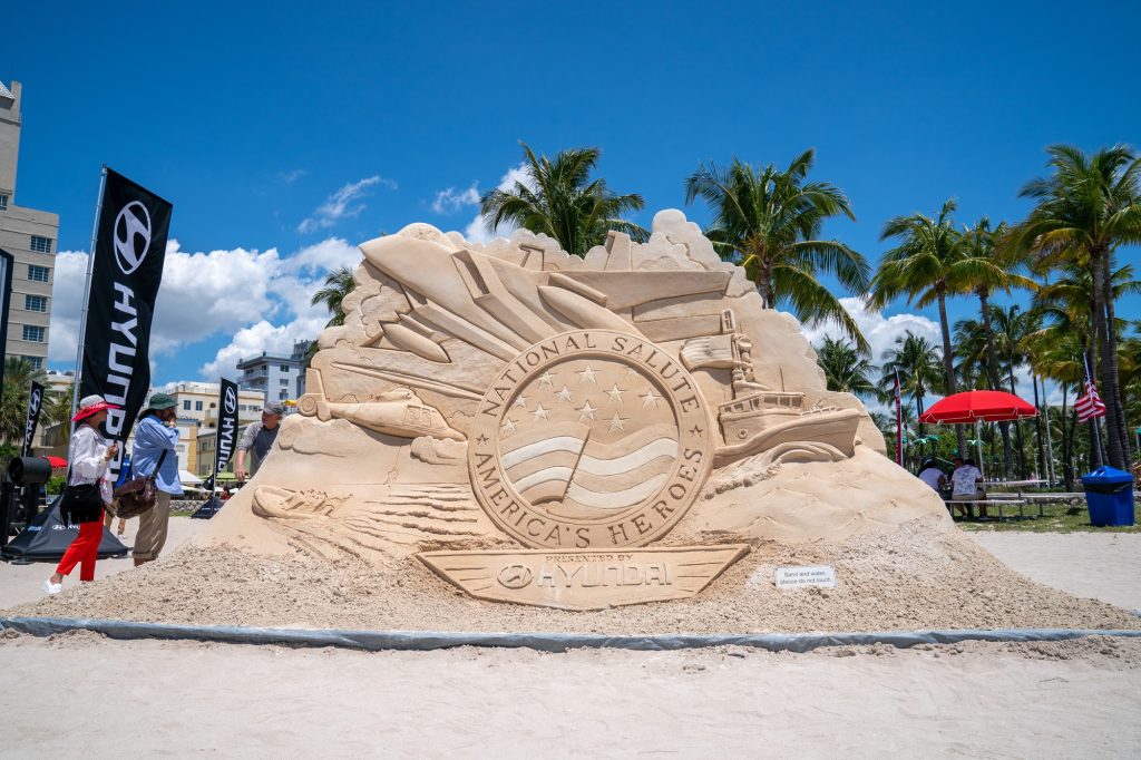 A sand sculpture featuring the logo of the Hyundai Air and Sea Show greets beachgoers in the display village at Miami Beach on May 28, 2023.
