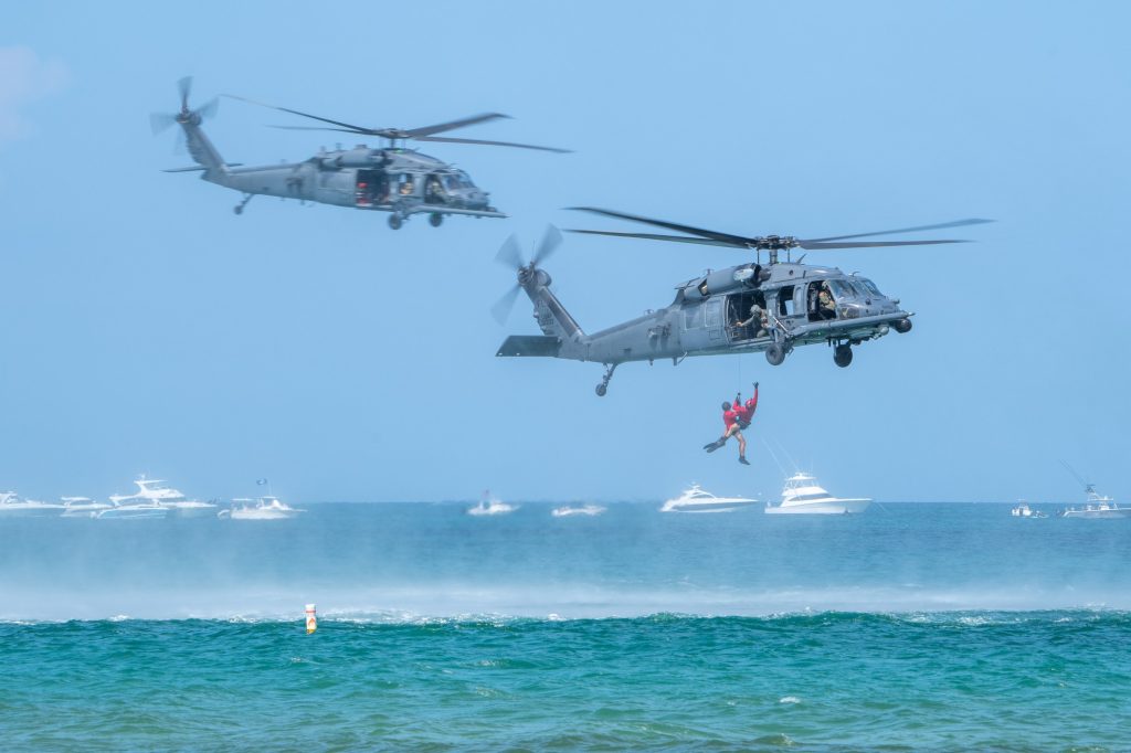 U.S. Air Force Pararescuemen of the 38th Rescue Squadron are pulled out of the ocean during the 920th Rescue Wing Demonstration at the Hyundai Air and Sea Show at Miami Beach on May 28, 2023.
