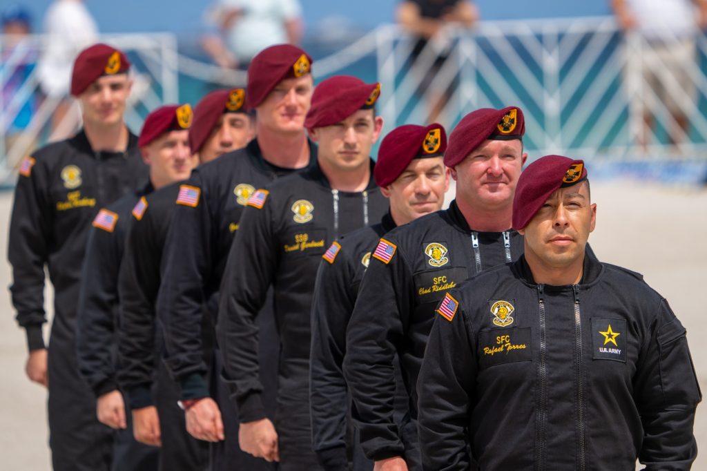 Members of the U.S. Army Parachute Team’s Black Demonstration Team stand during introductions after their demonstration in the skies over Miami Beach at the Hyundai Air and Sea Show on May 27, 2023.
