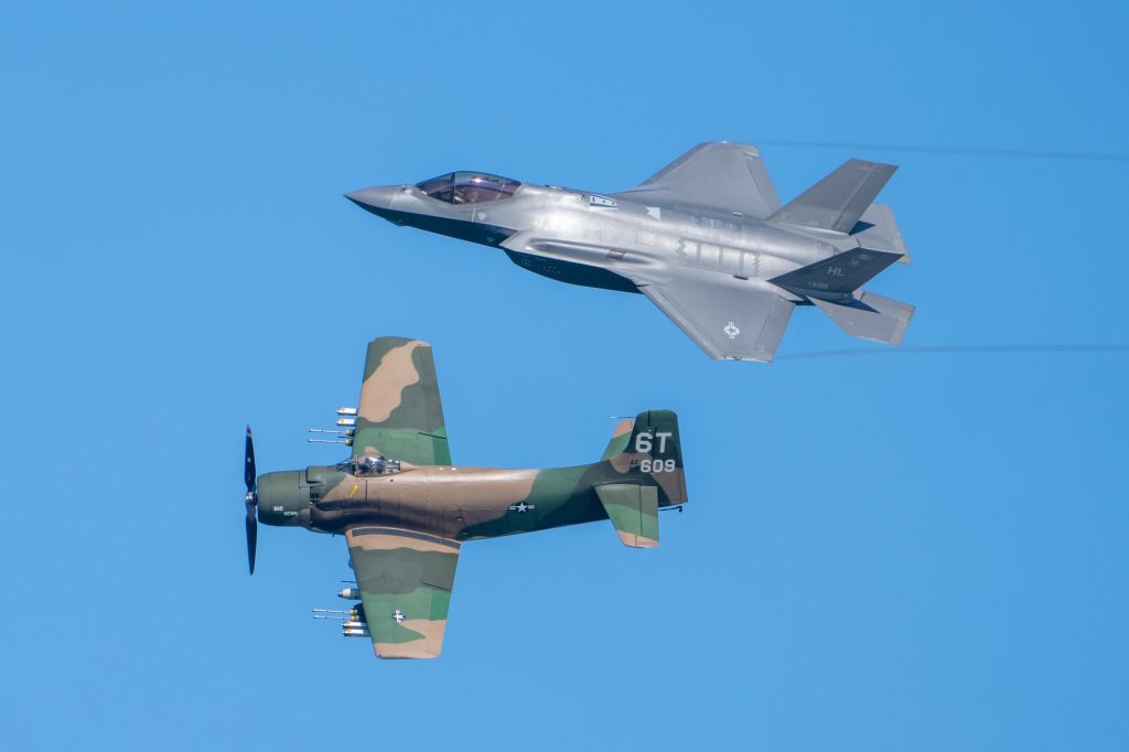 A F-35A flies in formation with an A1 Skyraider during the Air Force Heritage Flight at the Hyundai Air and Sea Show at Miami Beach on May 28, 2023. The Air Force Heritage Flight Foundation is a 501(c)(3) nonprofit organization that pairs historic and modern aircraft as a living memorial to those serving.