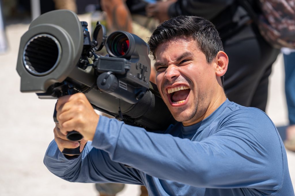 Israel Labarca holds a Carl Gustaf recoilless rifle in the display village of the Hyundai Air and Sea Show at Miami Beach on May 28, 2023.