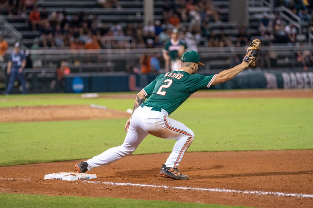 Junior infielder CJ Kayfus gets the out at first at the top of the seventh inning of Miami’s Coral Gables Regional game versus the University of Maine at Mark Light Field on June 2, 2023.