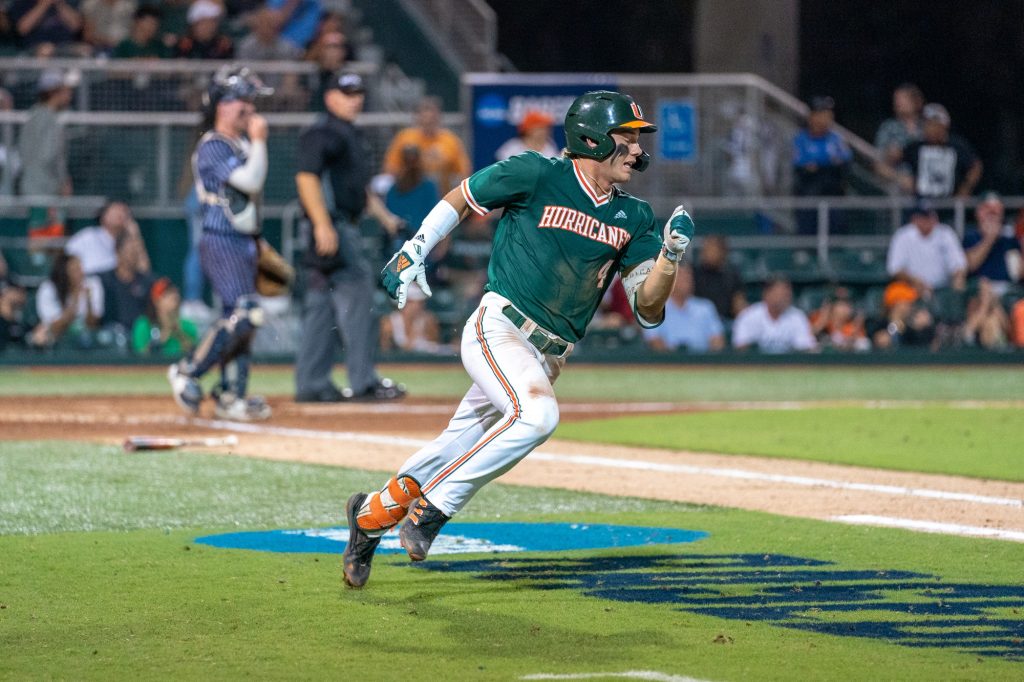 Freshman infielder Blake Cyr heads for second after hitting a double in the bottom of the seventh inning of Miami’s Coral Gables Regional game versus the University of Maine at Mark Light Field on June 2, 2023.