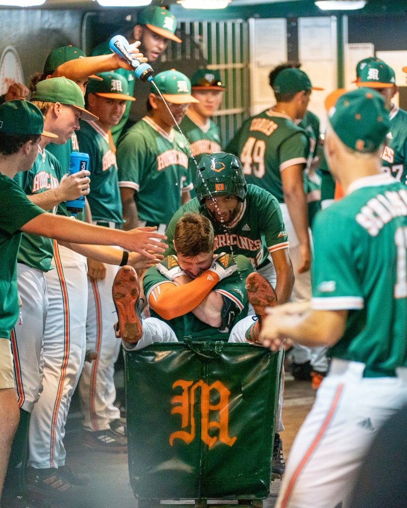 Junior outfielder Zach Levenson celebrates in the dugout after hitting a two-run home run in the bottom of the seventh inning of Miami’s Coral Gables Regional game versus the University of Maine at Mark Light Field on June 2, 2023. The home run extended Miami’s lead to 9-1.