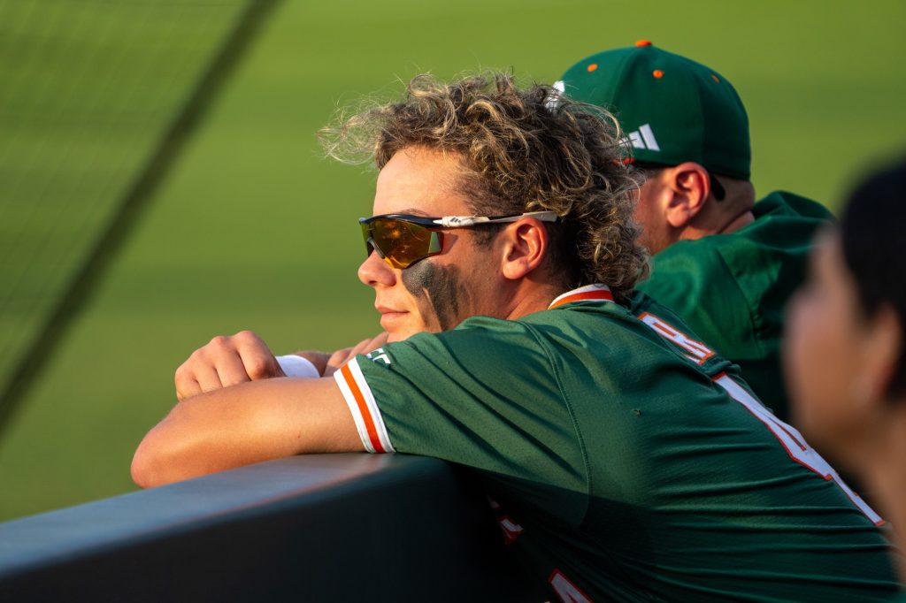 Freshman infielder Blake Cyr leans on the dugout wall before the start of Miami’s Coral Gables Regional game versus the University of Maine at Mark Light Field on June 2, 2023.