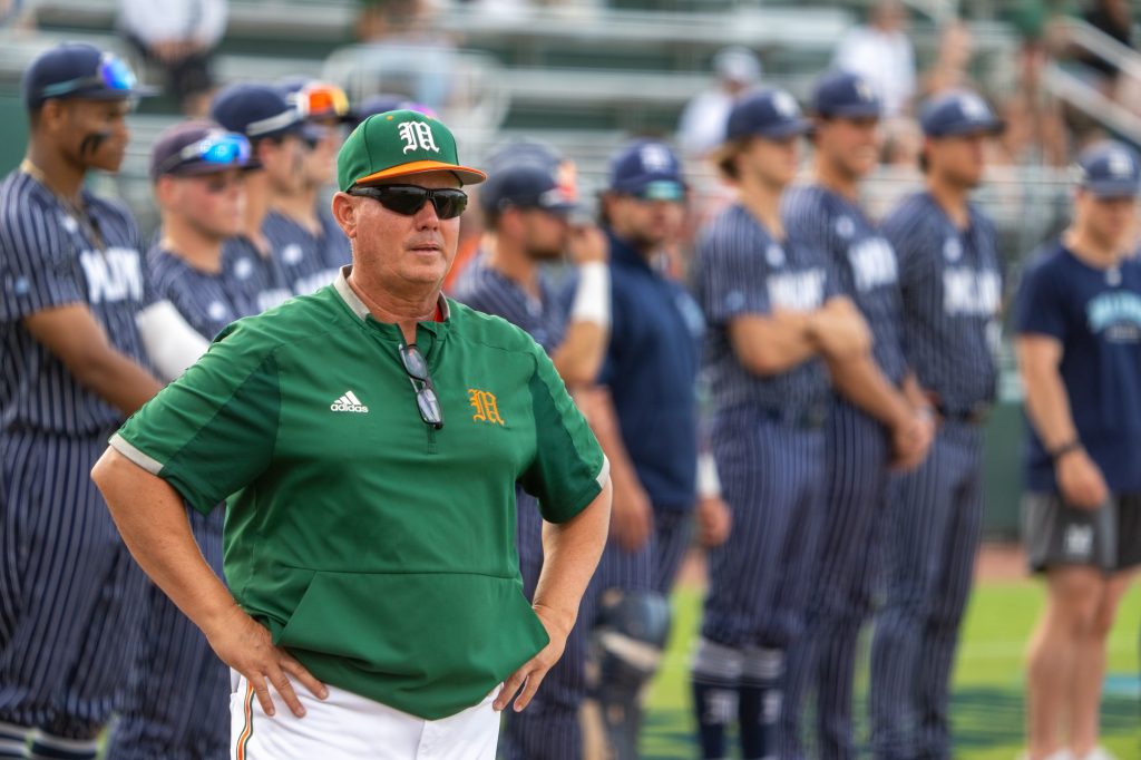 Head coach Gino DiMare stands during introductions before the start of Miami’s Coral Gables Regional game versus the University of Maine at Mark Light Field on June 2, 2023.