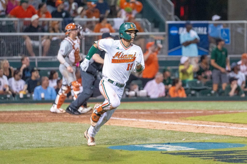 Junior infielder Dominic Pitelli hits a home run in the bottom of the fourth inning of Miami’s Coral Gables Regional game versus the University of Texas at Mark Light Field on June 3, 2023.