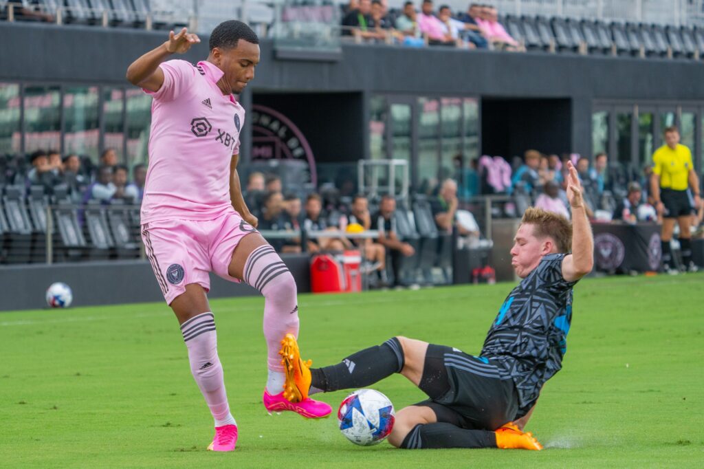 Israel Boatwright faces a challenge on the ball in the first half of Inter Miami CF II’s match versus Crown Legacy FC at DRV PNK Stadium on Aug. 19, 2023.