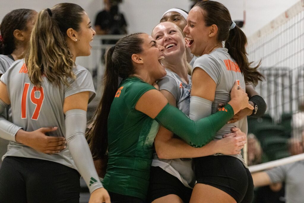 The team celebrates after winning the fourth and final set against FAU on August 28 at the Knight Sports Complex.