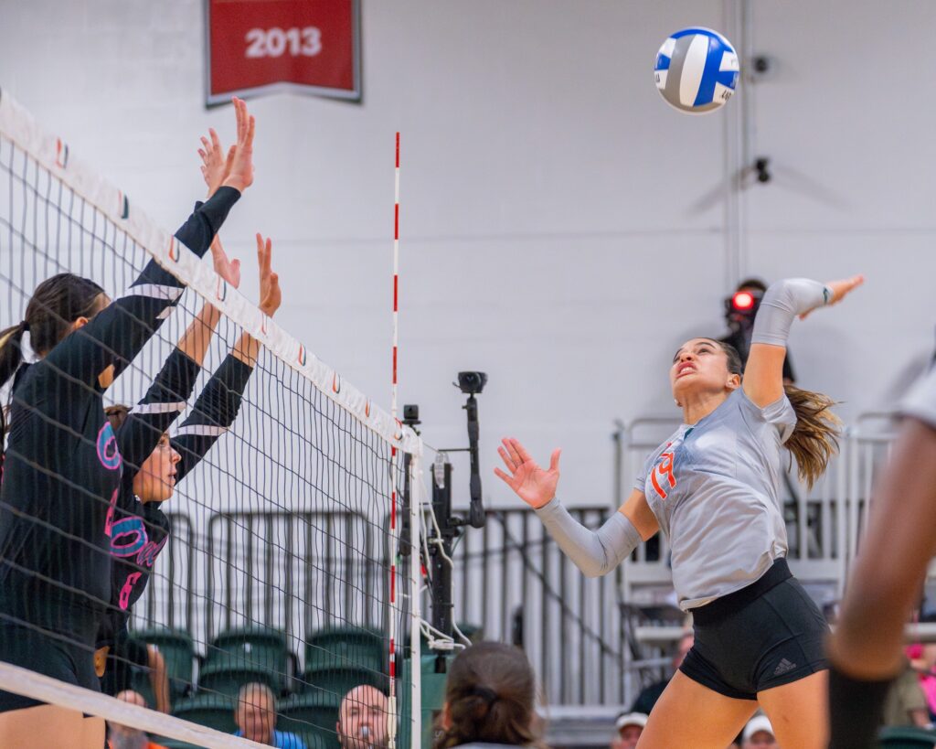 Junior outside hitter Peyman Yardimci spikes the ball during the first set of Miami’s match versus Florida Atlantic University in the Knight Sports Complex on Aug. 28, 2023.
