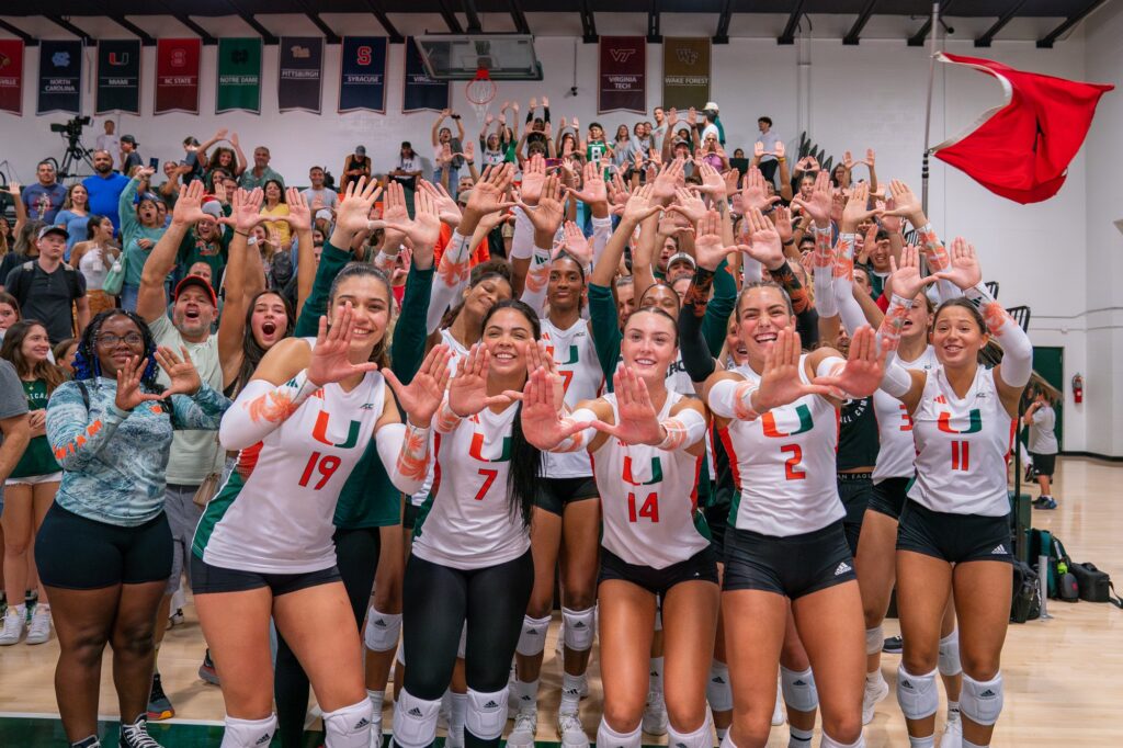 ‘Canes volleyball players and the Category 5 Student Section film a victory TikTok after Miami’s 3-0 win over Florida International University in the Knight Sports Complex on Aug. 26, 2023.