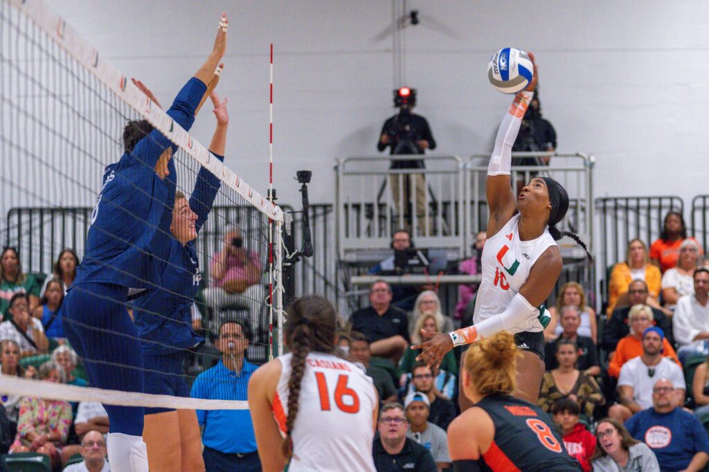 Sophomore outside hitter Flormarie Heredia Colon spikes the ball during the first set of Miami’s match versus Florida International University in the Knight Sports Complex on Aug. 26, 2023.