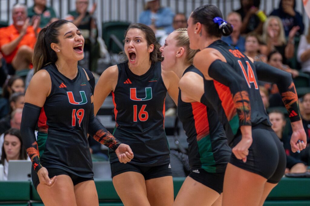 Junior outside hitter Peyman Yardimci celebrates with teammates after scoring a point during the first set of Miami’s match versus Maryland in the Knight Sports Complex on Aug. 25, 2023.