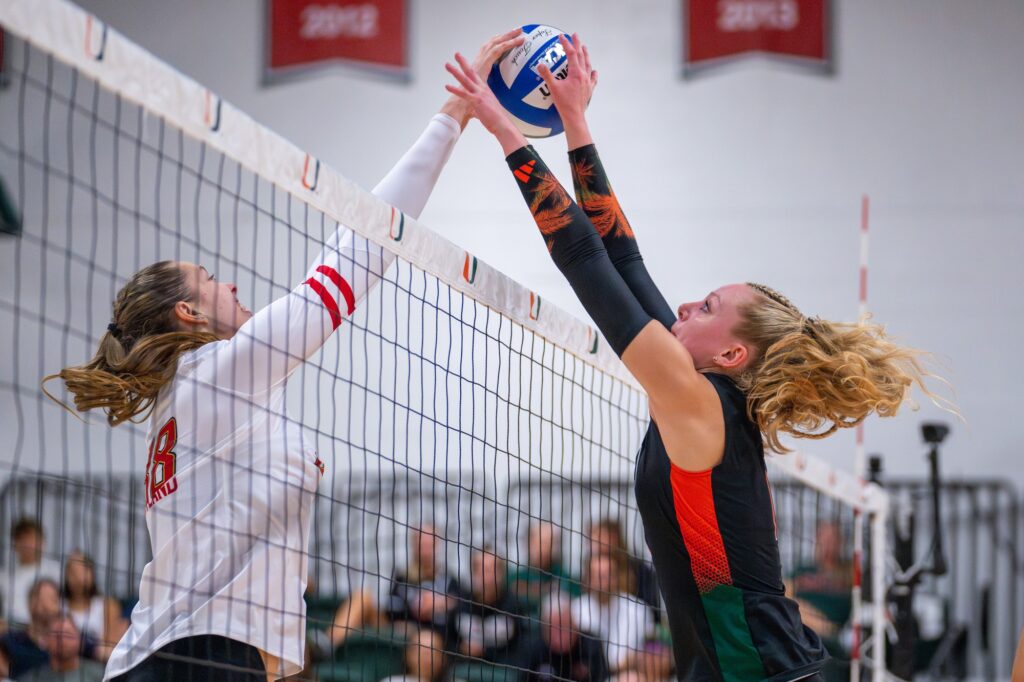 Fifth-year setter Savannah Vach makes a play at the net during the third set of Miami’s match versus Maryland in the Knight Sports Complex on Aug. 25, 2023.