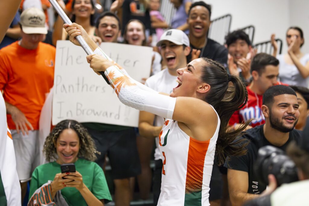 credit: Alexandra Fisher // Sophomore libero Naylani Feliciano waves the hurricane warning flag after winning against FIU on August 26, 2023.