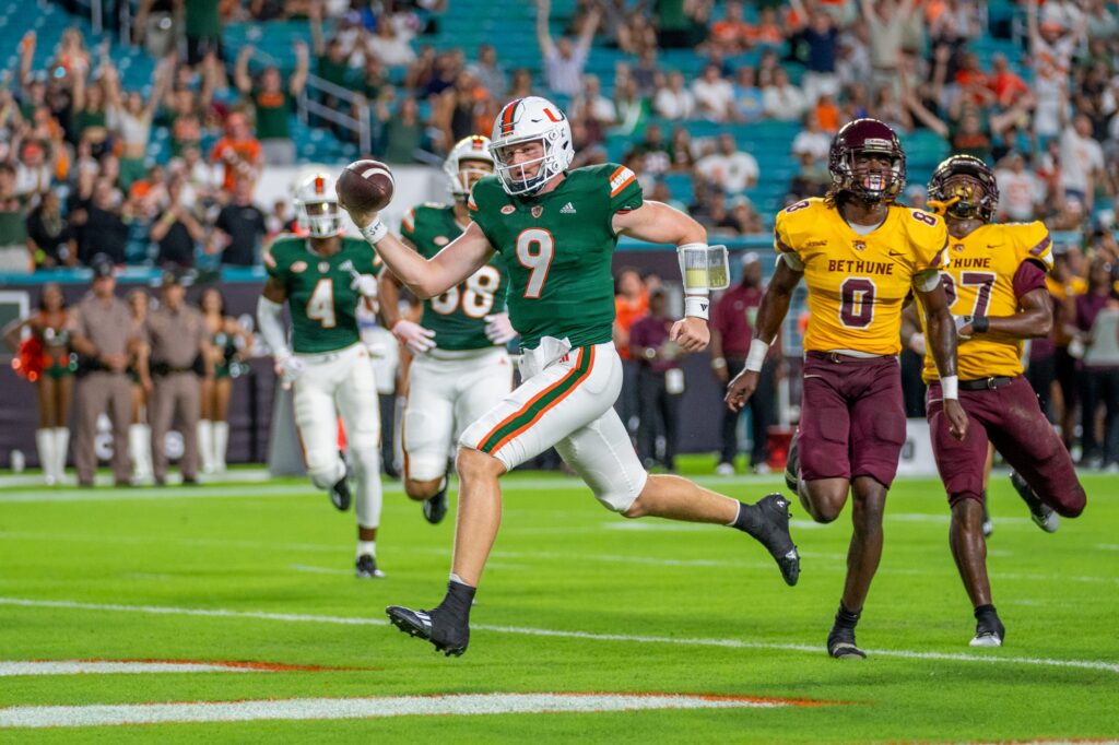 Fourth-year junior quarterback Tyler Van Dyke scrambles for a touchdown in the first quarter of Miami’s game versus Bethune Cookman at Hard Rock Stadium on Sept. 14, 2023.
