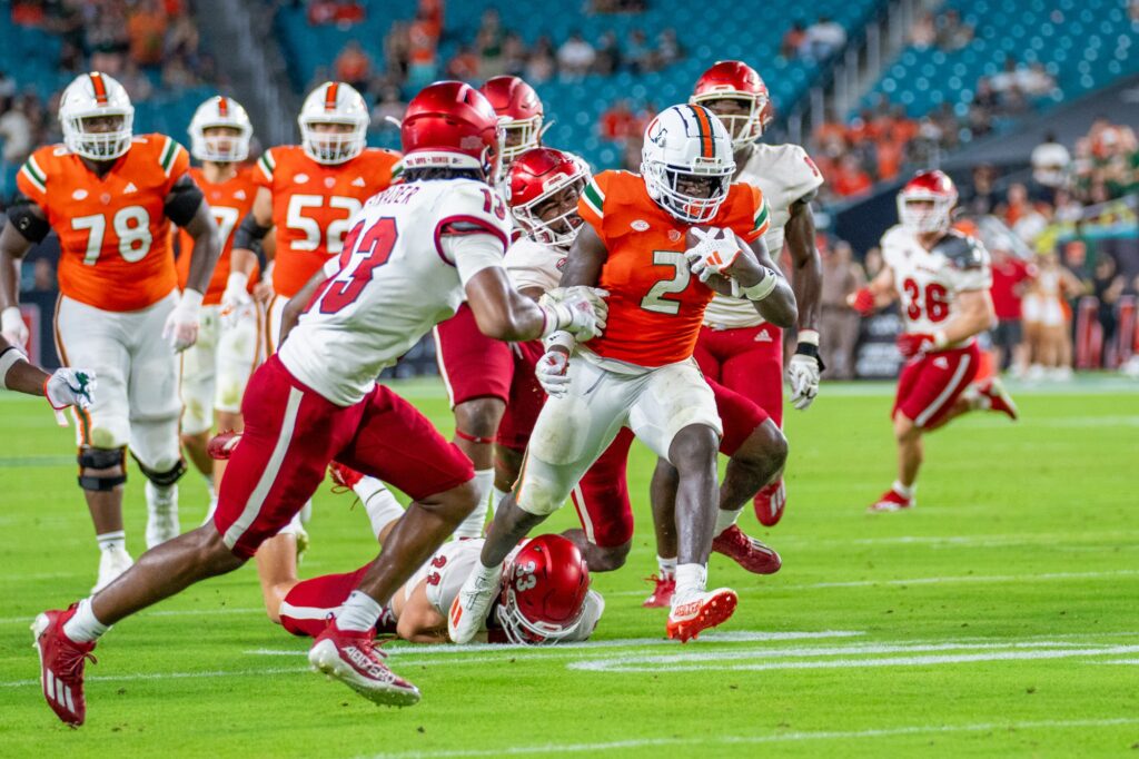 Fourth-year redshirt sophomore running back Donald Chaney, Jr. evades tacklers during his 20-yard rushing touchdown in the fourth quarter of Miami’s game versus Miami (OH) at Hard Rock Stadium on Sept. 1, 2023.