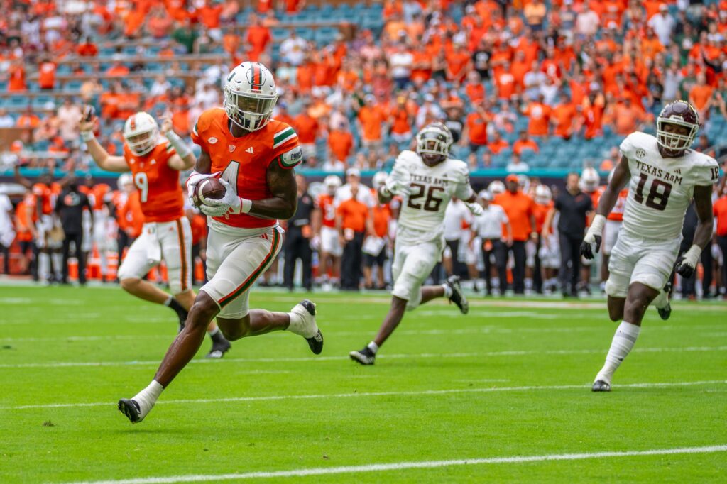 Junior wide receiver Colbie Young catches a touchdown pass from fourth-year junior quarterback Tyler Van Dyke in the first quarter of Miami’s game versus Texas A&M at Hard Rock Stadium on Sept. 9, 2023.