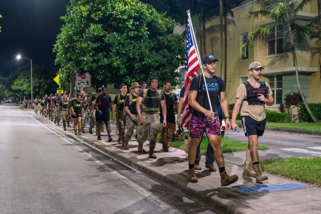 UM Ruck to Remember founder and organizer senior Alex Westover leads the group down San Amaro Drive during the fourth annual UM Ruck to Remember in the early morning of Sept. 11, 2023.