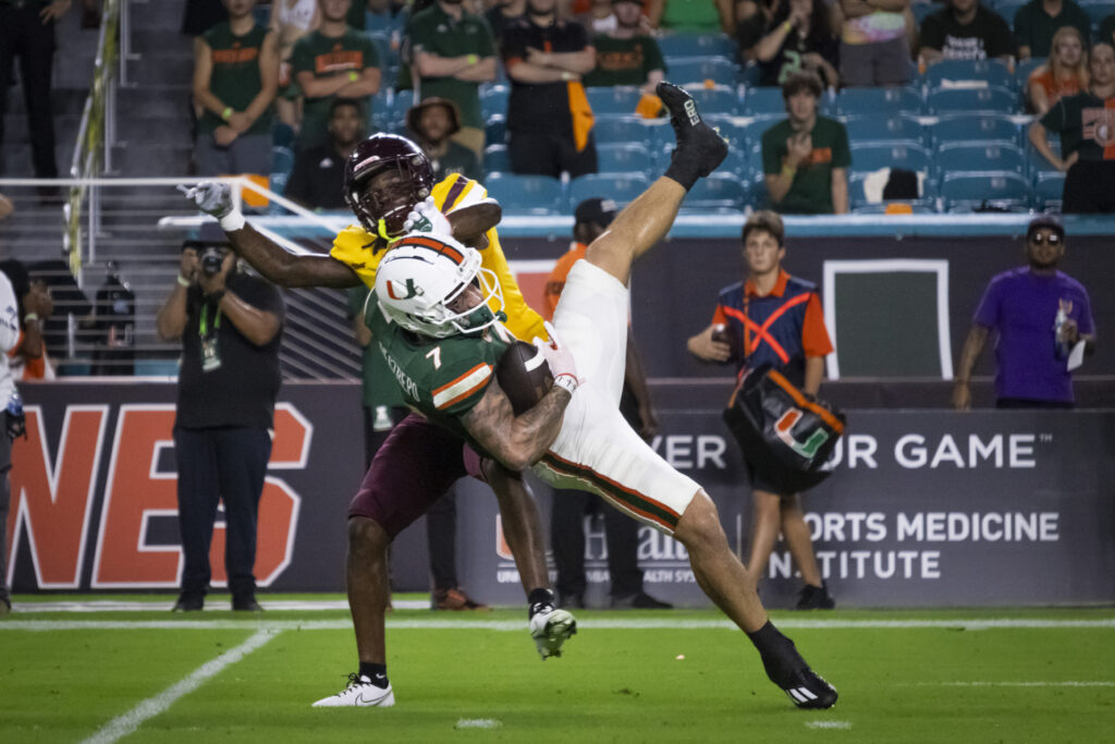Fourth-year junior Xavier Restrepo catches a pass from quarterback Tyler Van Dyke for 26 yards late in the first quarter against Bethune-Cookman University at Hard Rock Stadium.