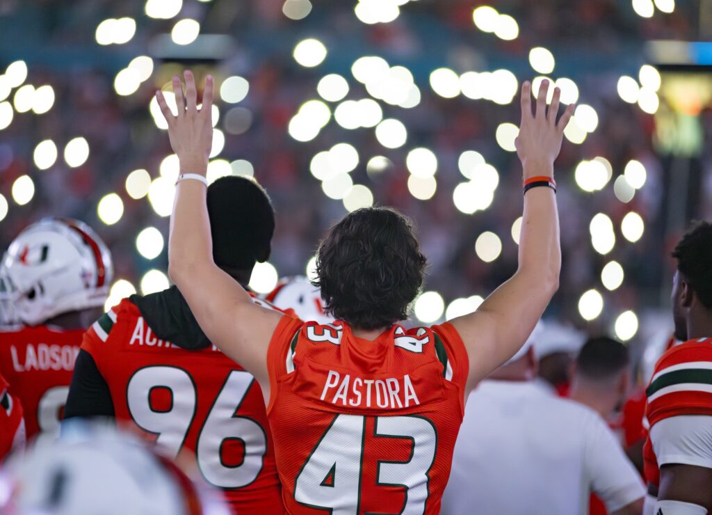Fifth-year senior wide receiver Chris Pastora holds up fours at the start of the fourth quarter during Miami's game against Miami University (OH) at Hard Rock Stadium on Sept. 1, 2023.