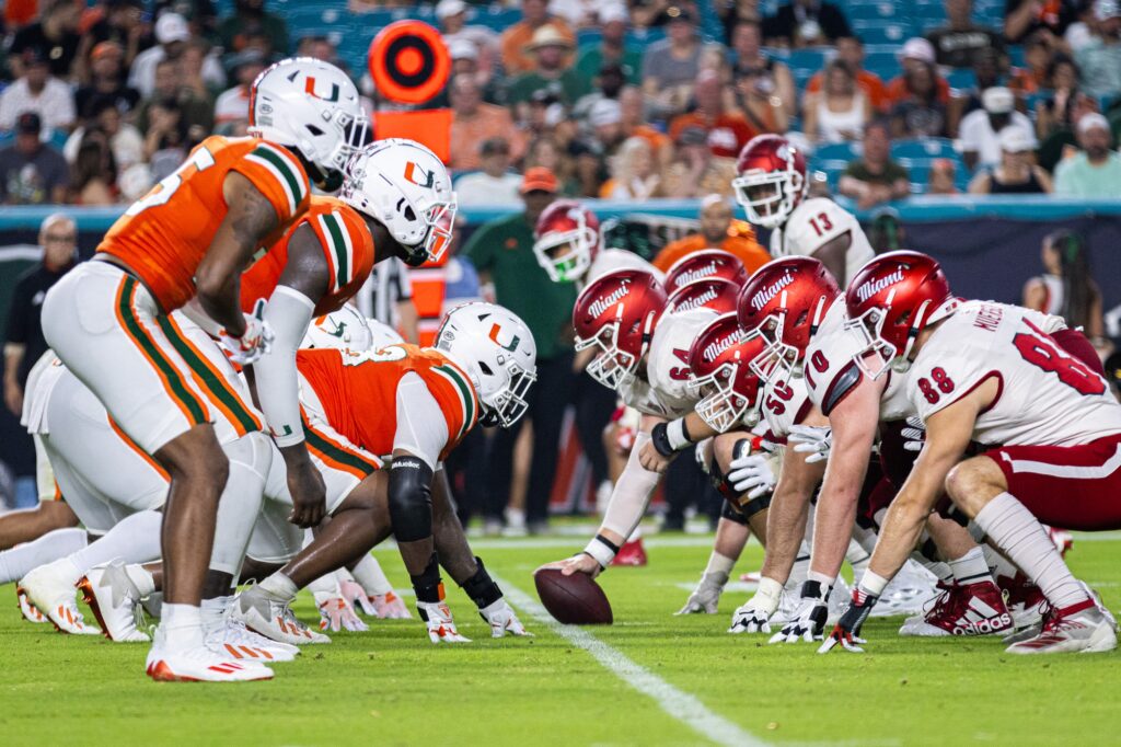 Miami University's offensive line and the University of Miami's defensive line meets at the line of scrimmage during the third quarter of the season opening matchup. credit: Charisma Jones