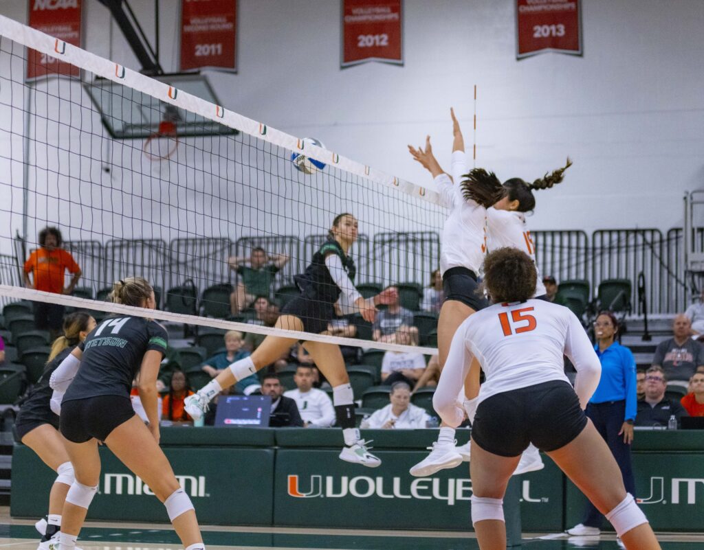 Sophomore outside hitter Cianna Tejada and junior outside hitter Peyman Yardimci block a Stetson swing at the Knight Sports Complex on Sept. 16, 2023.