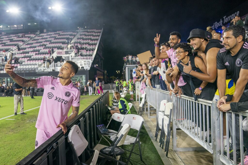 Miami midfielder Gregory takes a selfie with supporters after Inter Miami’s 2-2 draw with Charlotte FC at DRV PNK Stadium on Oct. 18, 2023.
