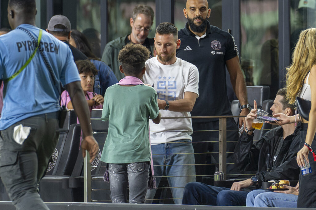 Miami forward Lionel Messi signs an autograph after Inter Miami drew 2-2 with Charlotte FC at DRV PNK Stadium on Oct. 18, 2023.