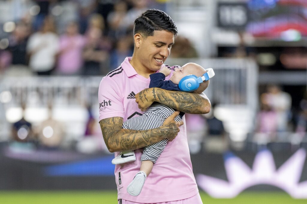 Miami midfielder Facundo Farías holds his son during the national anthem ahead of Inter Miami’s match versus Charlotte FC at DRV PNK Stadium on Oct. 18, 2023.