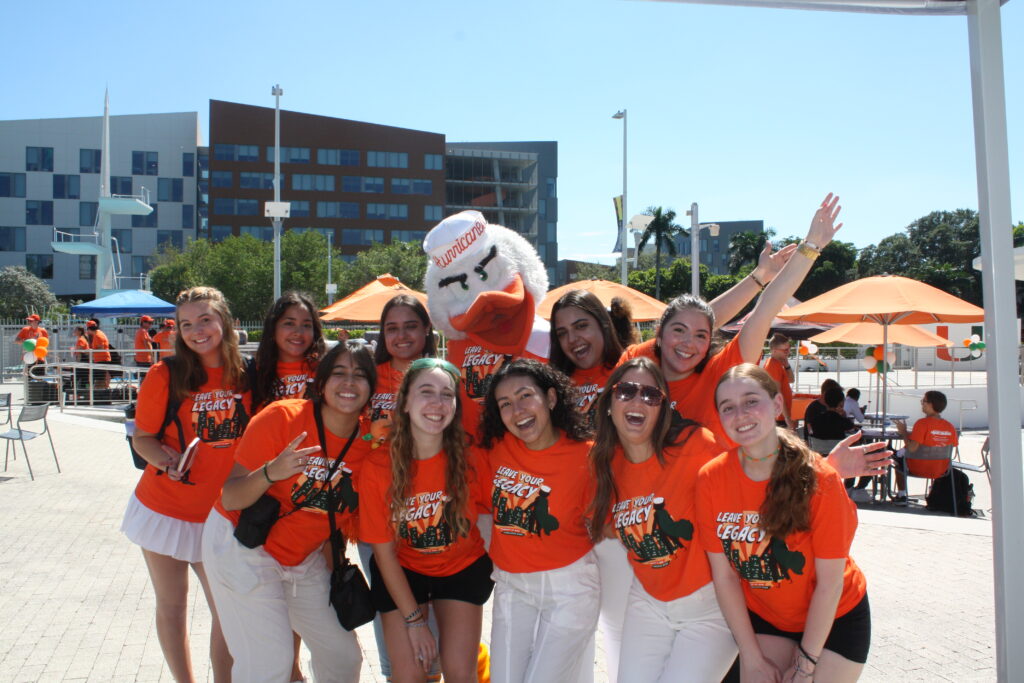 Members of the Homecoming Executive Committee (HEC) pose with Miami mascot Sebastian the Ibis at the 2023 Homecoming Opening Ceremony at Lakeside Patio on Oct. 23, 2023.