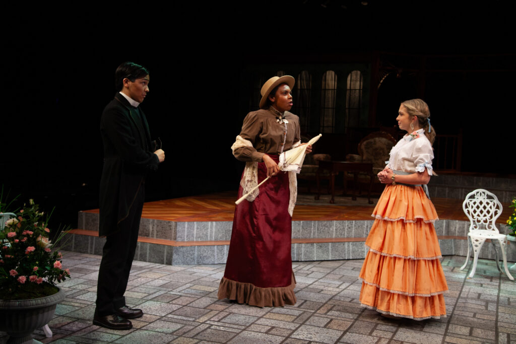 Cecily Cardew (Maggie Rabitsch, right), Rev. Chasuble (Ian Luk, left) and Miss Prism
(Leandrea Brooks, center)cperform in the UM production of “The Importance of Being
Earnest” in the Jerry Herman Ring Theatre on Oct. 4, 2023.