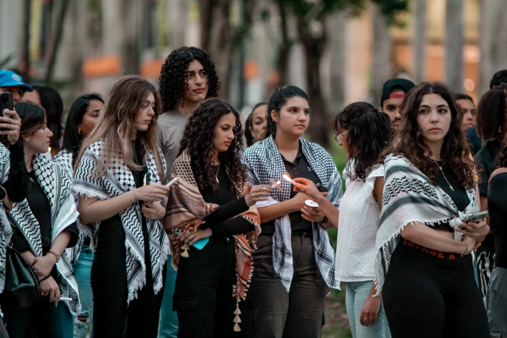 Students and members of the Miami community participate in candlelight vigil on Monday Oct. 23 at the Rock.