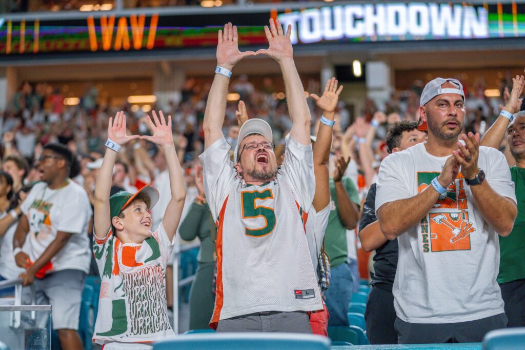 ‘Canes fans celebrate a touchdown in the first quarter of Miami’s game versus Clemson at Hard Rock Stadium on Oct. 21, 2023.