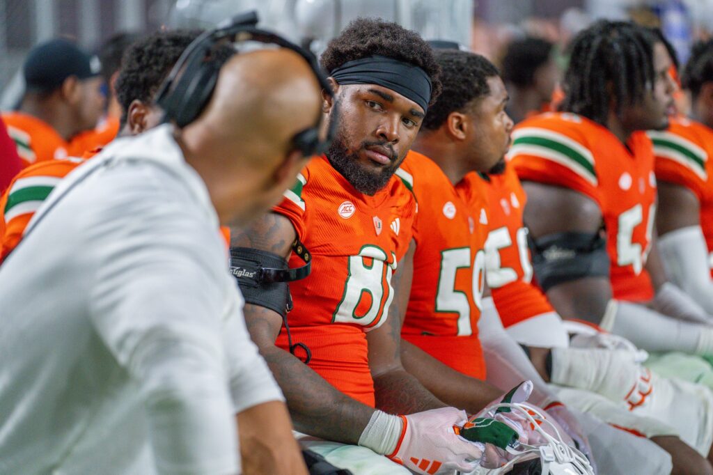Fifth-year redshirt junior defensive lineman Jared Harrison-Hunte listens to defensive line coach Jason Taylor in the fourth quarter of Miami’s game versus Clemson at Hard Rock Stadium on Oct. 21, 2023.