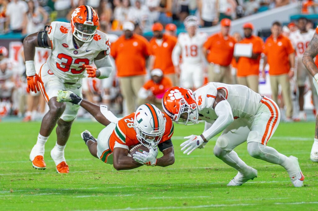 Redshirt freshman running back Ajay Allen dives for extra yards in the fourth quarter of Miami’s game versus Clemson at Hard Rock Stadium on Oct. 21, 2023.