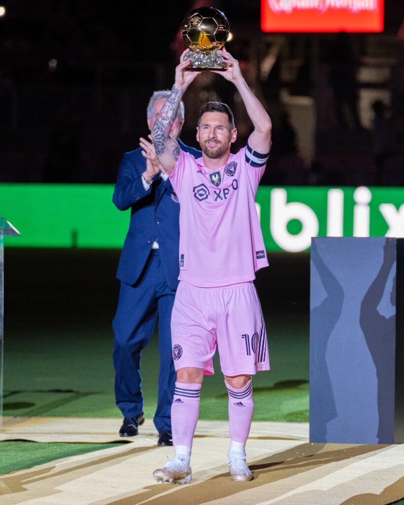 Miami forward Lionel Messi lifts his Ballon d’Or during a recognition ceremony ahead of Inter Miami’s friendly match versus New York City FC at DRV PNK Stadium on Nov. 10, 2023.