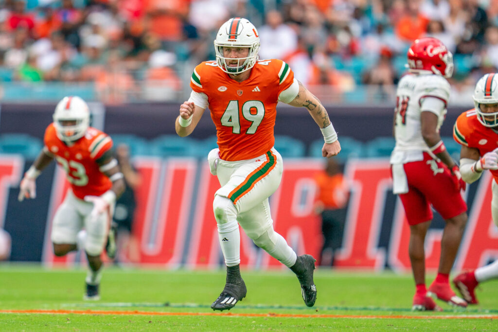 Fourth-year redshirt sophomore long snapper Mason Napper runs downfield to cover the Louisville punt returner in the third quarter of Miami’s game versus Louisville at Hard Rock Stadium on Nov. 18, 2023.