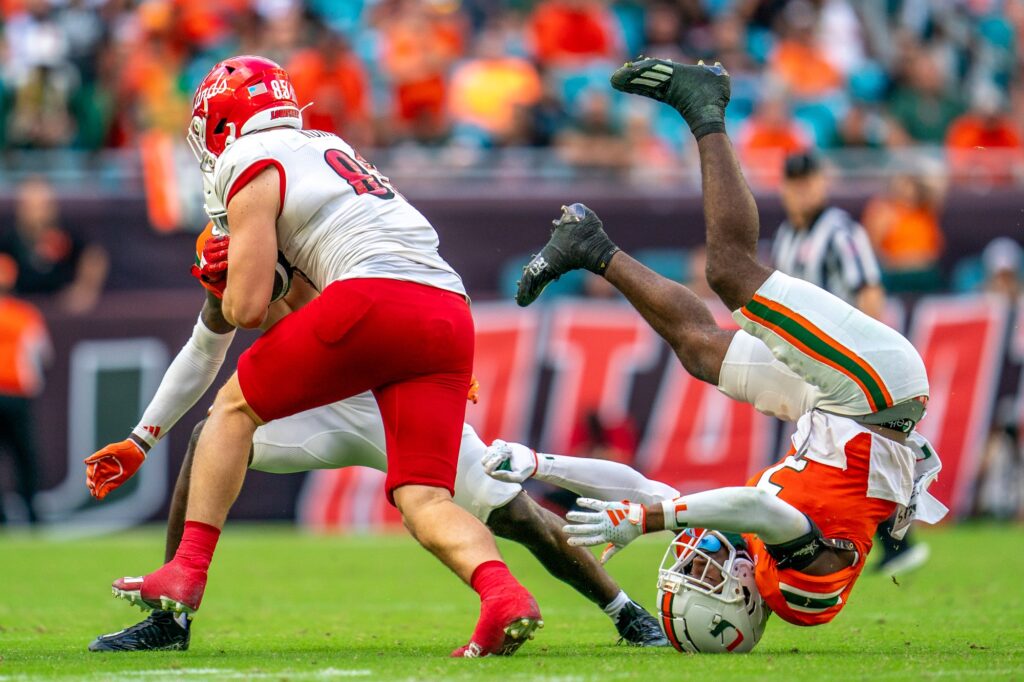 Louisville sophomore tight end Nate Kurisky evades defenders in the fourth quarter of Miami’s game versus Louisville at Hard Rock Stadium on Nov. 18, 2023.